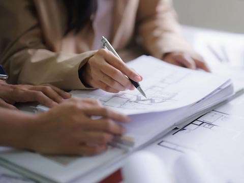 Architect or designer drawing freehand